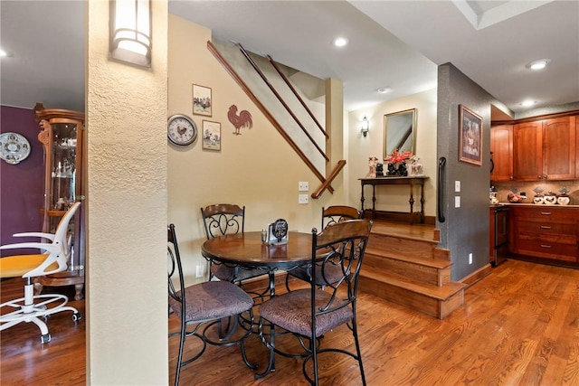 30 Brittany Ln, Bella Vista, AR 72714 - dining area with stairway, wood finished floors, and recessed lighting