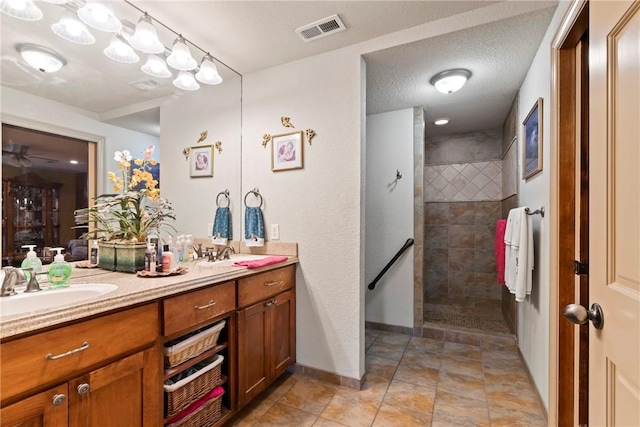 30 Brittany Ln, Bella Vista, AR 72714 - bathroom with double vanity, a walk in shower, and baseboards