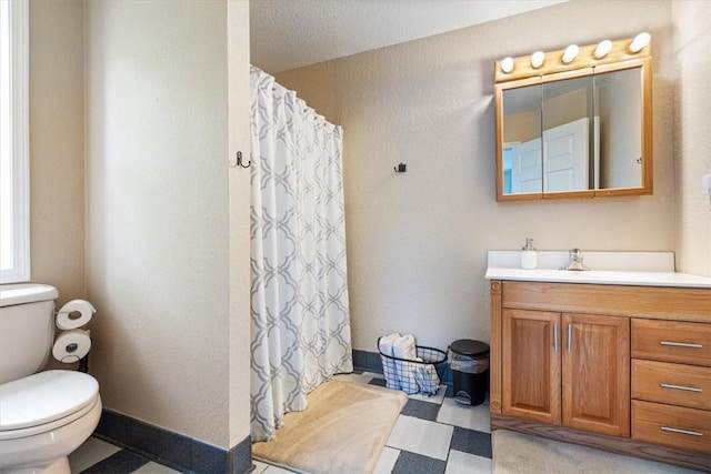 22058 Dogwood Cir, Springdale, AR 72764 - full bathroom with toilet, vanity, curtained shower, a textured wall, and tile patterned floors