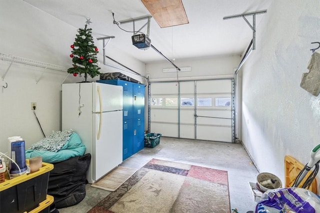 22058 Dogwood Cir, Springdale, AR 72764 - garage with freestanding refrigerator and a garage door opener