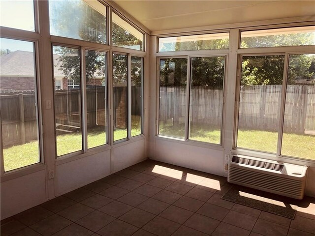 unfurnished sunroom with tile patterned flooring