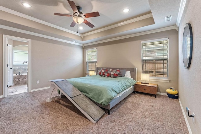 bedroom with carpet flooring, ornamental molding, baseboards, a tray ceiling, and recessed lighting
