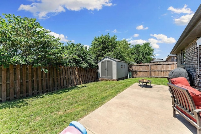 view of yard with an outdoor fire pit, a patio, a shed, and an outdoor structure
