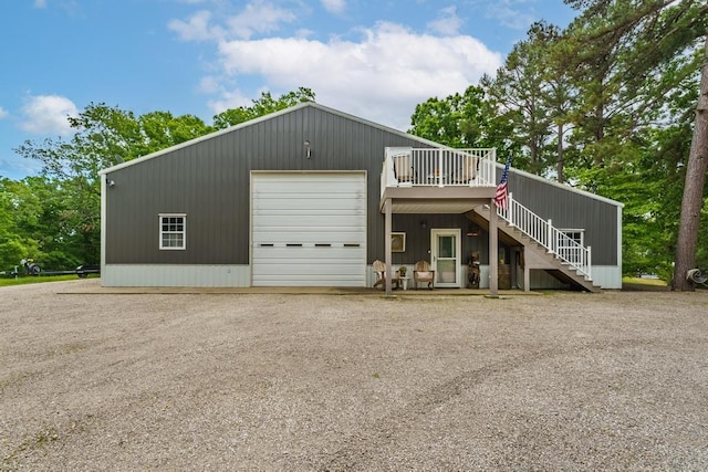 103 County Road 1522, Eureka Springs, AR 72632 - view of front of house with stairs, a wooden deck, a garage, and gravel driveway