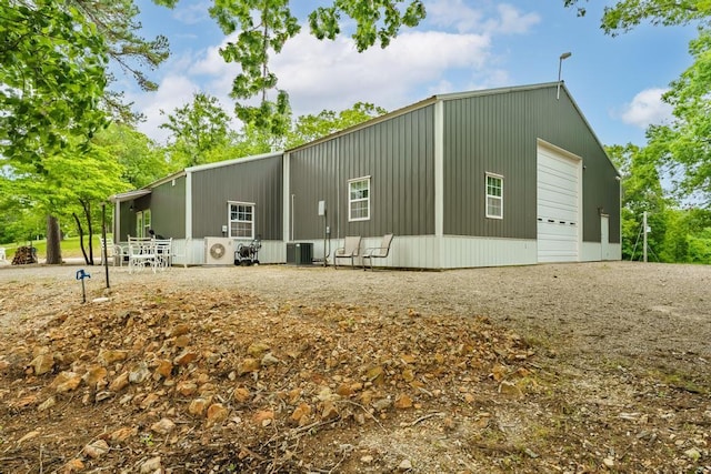 103 County Road 1522, Eureka Springs, AR 72632 - view of property exterior with a detached garage and driveway