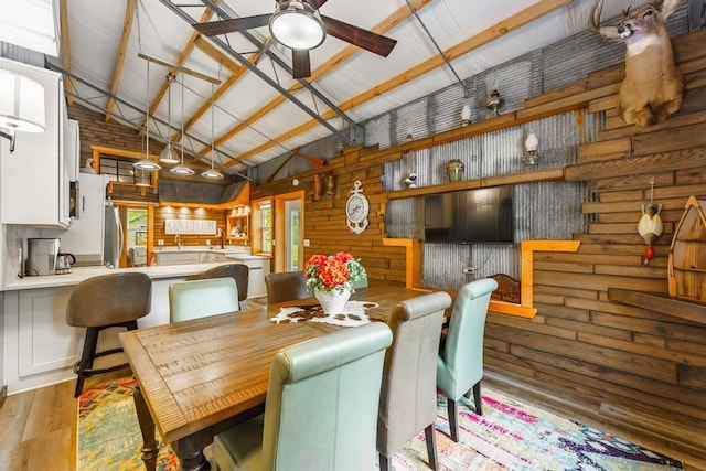 103 County Road 1522, Eureka Springs, AR 72632 - dining room with ceiling fan, wood finished floors, high vaulted ceiling, and beam ceiling