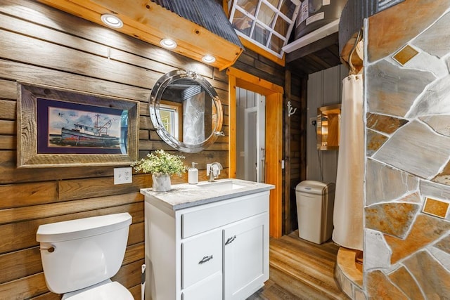 103 County Road 1522, Eureka Springs, AR 72632 - bathroom featuring vanity, wood finished floors, and wood walls