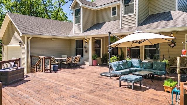 9696 Fuller Rd, Rogers, AR 72756 - wooden terrace with an outdoor hangout area, outdoor dining area, and an attached garage