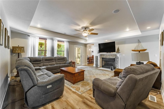 9696 Fuller Rd, Rogers, AR 72756 - living area featuring a raised ceiling, light wood-style floors, a ceiling fan, recessed lighting, and crown molding
