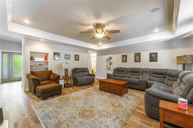 9696 Fuller Rd, Rogers, AR 72756 - living room featuring a raised ceiling, crown molding, a ceiling fan, wood finished floors, and recessed lighting