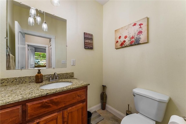 9696 Fuller Rd, Rogers, AR 72756 - bathroom featuring vanity, toilet, and baseboards