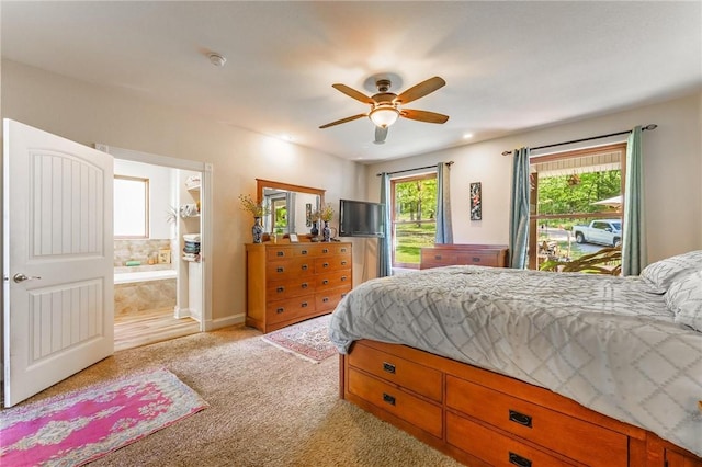 9696 Fuller Rd, Rogers, AR 72756 - bedroom featuring light carpet, ensuite bath, and a ceiling fan