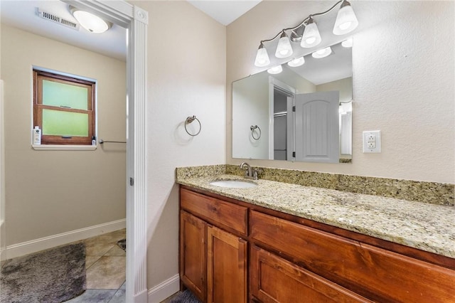 9696 Fuller Rd, Rogers, AR 72756 - bathroom with vanity, tile patterned floors, and baseboards