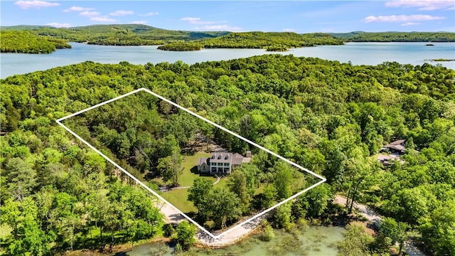 9696 Fuller Rd, Rogers, AR 72756 - aerial overview of property's location featuring a heavily wooded area, a nearby body of water, and property boundaries highlighted
