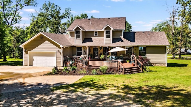 9696 Fuller Rd, Rogers, AR 72756 - back of house featuring an attached garage, a lawn, roof with shingles, and concrete driveway