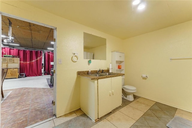 9696 Fuller Rd, Rogers, AR 72756 - bathroom featuring tile patterned flooring, vanity, and toilet