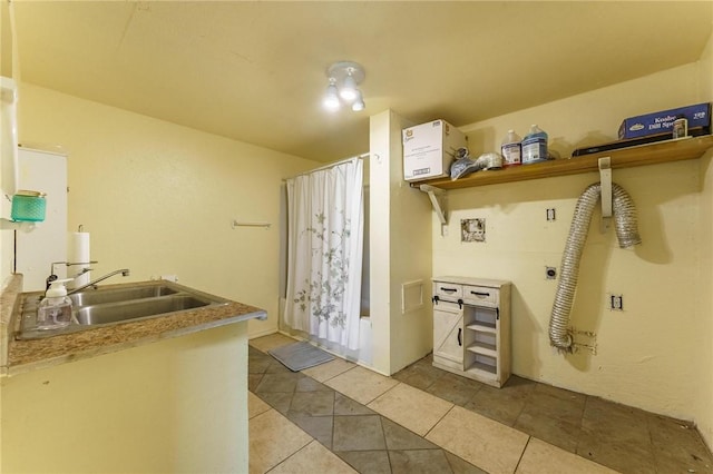 9696 Fuller Rd, Rogers, AR 72756 - laundry room with electric dryer hookup, tile patterned floors, and washer hookup