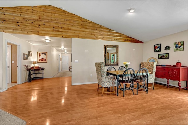 17155 Deer Park Ln, Pea Ridge, AR 72751 - dining space with wood finished floors, vaulted ceiling, and baseboards