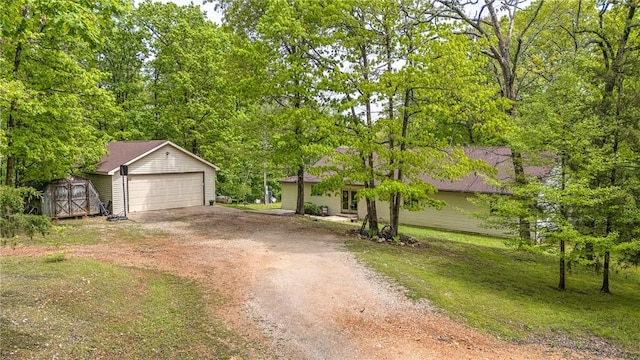 17155 Deer Park Ln, Pea Ridge, AR 72751 - view of front of property featuring an outdoor structure, a detached garage, a shed, and a front lawn