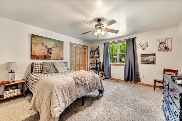 17155 Deer Park Ln, Pea Ridge, AR 72751 - bedroom featuring light colored carpet, a closet, baseboards, and a ceiling fan