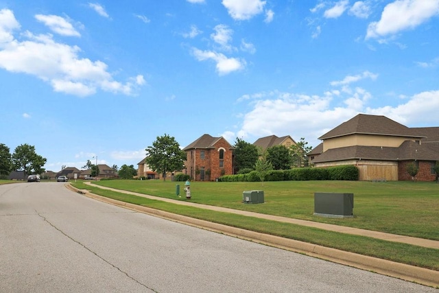 2636 Everest Ave, Rogers, AR 72758 - view of asphalt road with sidewalks, curbs, and a residential view