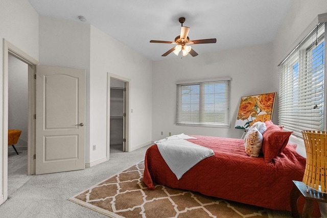 2636 Everest Ave, Rogers, AR 72758 - carpeted bedroom with a walk in closet, ceiling fan, and baseboards