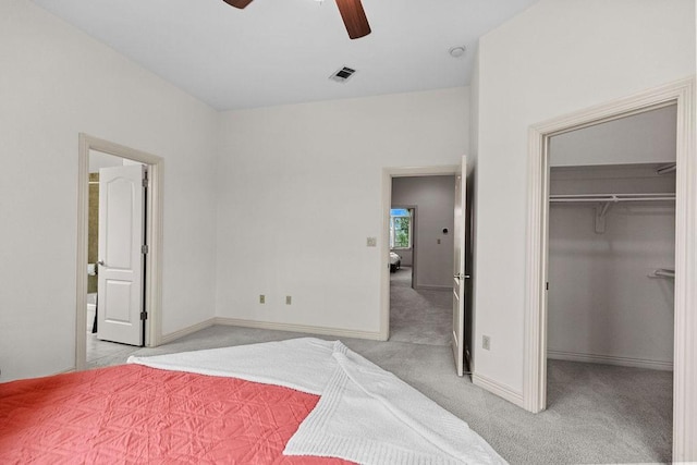 2636 Everest Ave, Rogers, AR 72758 - bedroom with carpet, a walk in closet, baseboards, a ceiling fan, and a closet
