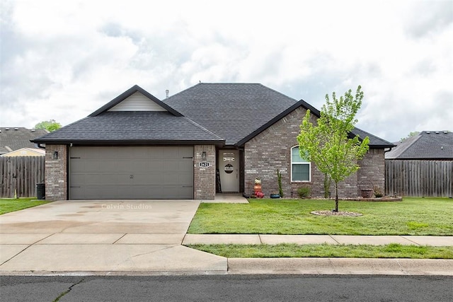 view of front of house with an attached garage, driveway, brick siding, and roof with shingles