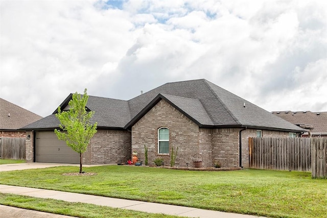 view of front facade featuring brick siding, a garage, driveway, and a shingled roof