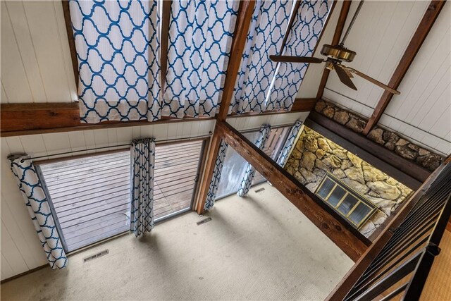 13 Rancho Vista Ln, Holiday Island, AR 72631 - unfurnished living room featuring ceiling fan, carpet floors, and wood walls