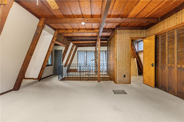 13 Rancho Vista Ln, Holiday Island, AR 72631 - unfurnished bedroom with wood walls, wooden ceiling with exposed beams, and carpet floors