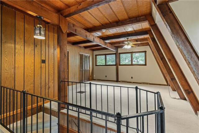 13 Rancho Vista Ln, Holiday Island, AR 72631 - carpeted empty room with a ceiling fan, wooden ceiling with exposed beams, and wood walls