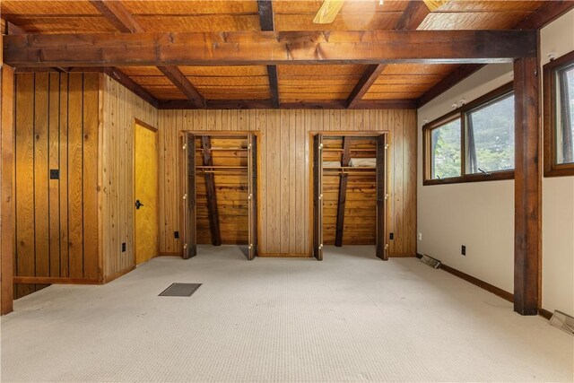13 Rancho Vista Ln, Holiday Island, AR 72631 - unfurnished bedroom with carpet flooring, wooden walls, wooden ceiling with exposed beams, and multiple closets
