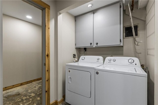 13 Rancho Vista Ln, Holiday Island, AR 72631 - laundry room with separate washer and dryer, cabinet space, and baseboards