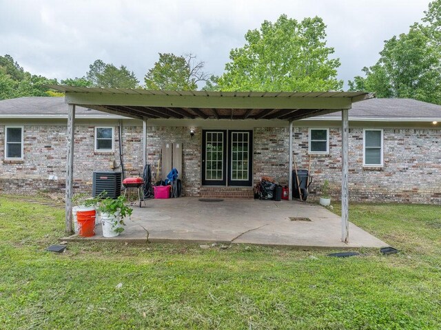 1503 Bugscuffle, Lavaca, AR 72941 - rear view of property featuring a yard, a patio area, and brick siding