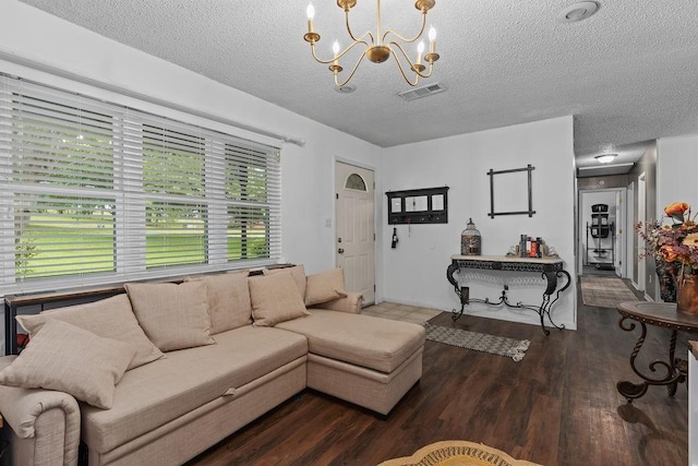 1503 Bugscuffle, Lavaca, AR 72941 - living room featuring a textured ceiling, a chandelier, and wood finished floors