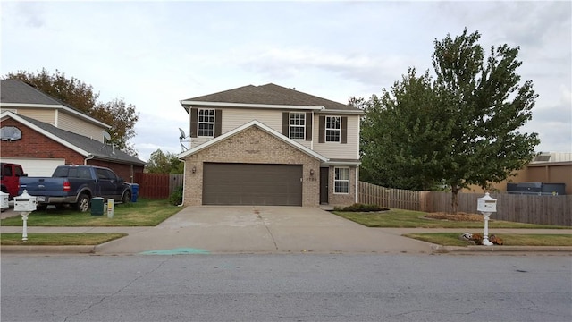 3703 Hansom Loop, Bentonville, AR 72712 - traditional-style home with brick siding, concrete driveway, and a garage