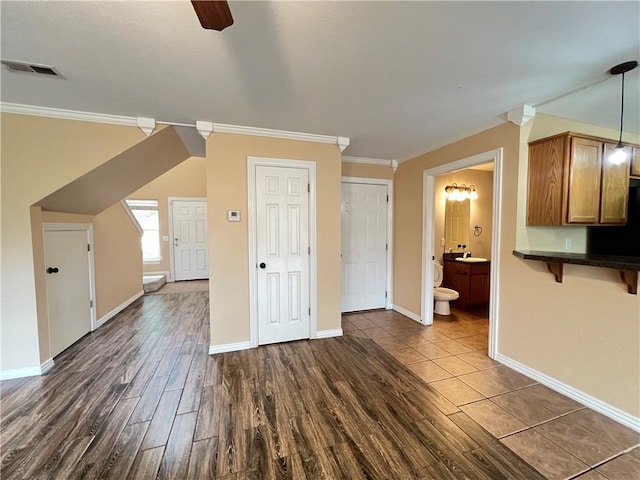 3703 Hansom Loop, Bentonville, AR 72712 - bonus room featuring dark wood finished floors, baseboards, and a ceiling fan