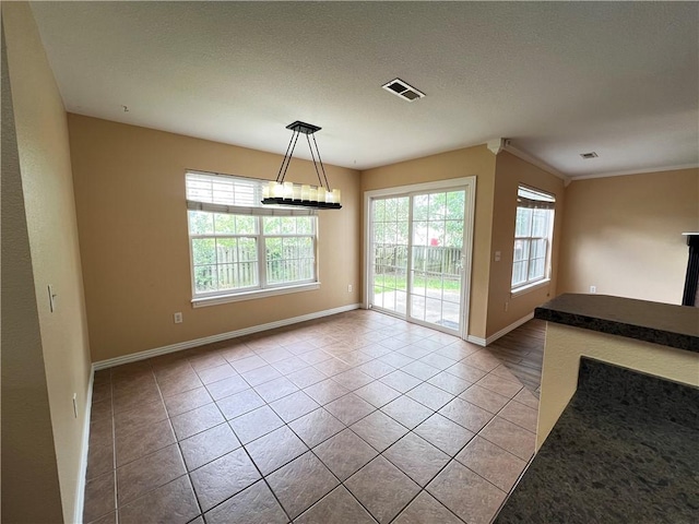 3703 Hansom Loop, Bentonville, AR 72712 - unfurnished dining area featuring tile patterned floors and baseboards