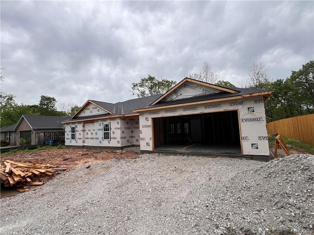 10 Roessler Ln, Bella Vista, AR 72715 - property under construction with a garage, fence, and driveway