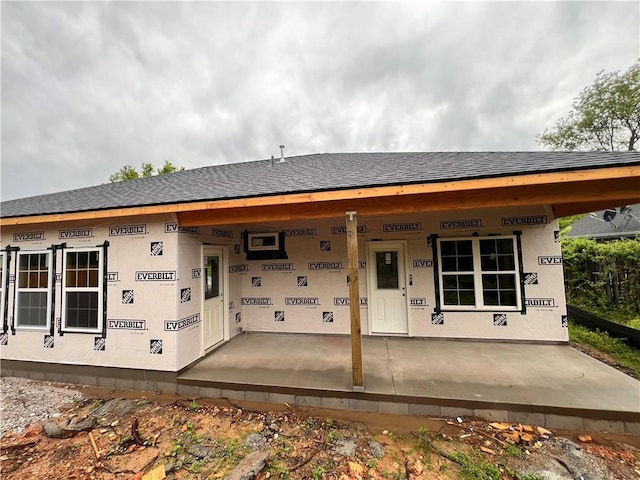 10 Roessler Ln, Bella Vista, AR 72715 - view of front facade featuring roof with shingles
