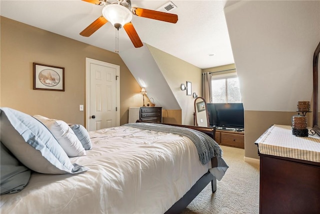 bedroom with light carpet, a ceiling fan, and vaulted ceiling