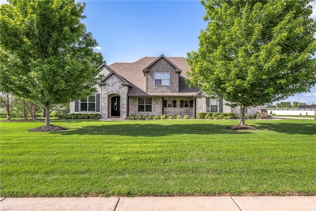 914 King Arthur Dr, Elm Springs, AR 72762 - view of front facade with a front yard and stone siding