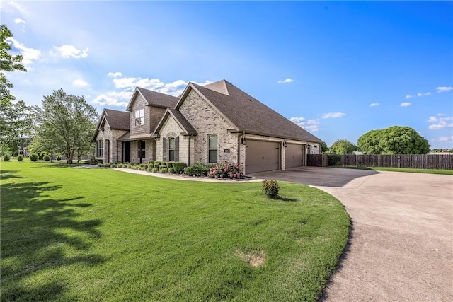 914 King Arthur Dr, Elm Springs, AR 72762 - view of front of house with concrete driveway, brick siding, an attached garage, and roof with shingles