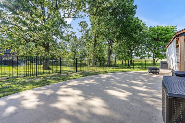 914 King Arthur Dr, Elm Springs, AR 72762 - view of patio / terrace featuring an outdoor fire pit