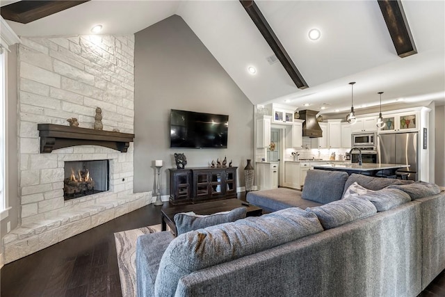 914 King Arthur Dr, Elm Springs, AR 72762 - living room with a fireplace, high vaulted ceiling, dark wood finished floors, baseboards, and beam ceiling