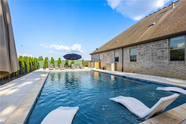 914 King Arthur Dr, Elm Springs, AR 72762 - view of pool with a diving board, fence, and a patio area
