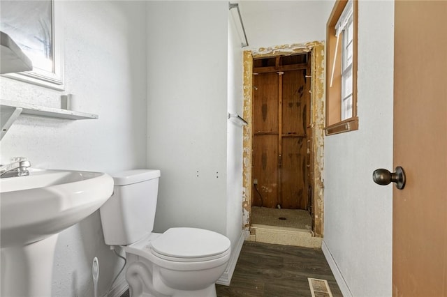 170 NC-8376, Jasper, AR 72641 - full bathroom with toilet, wood finished floors, a shower stall, and a sink