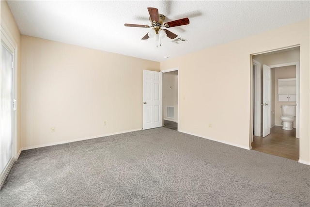 unfurnished bedroom featuring carpet flooring, baseboards, and ceiling fan