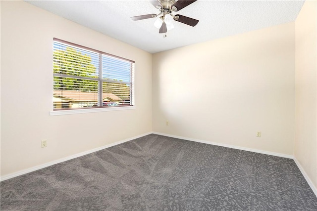 empty room featuring carpet floors, ceiling fan, and baseboards